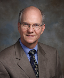 Dr. Kenrick Dennis