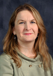 Dr. Sheley Revis, MD