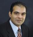Dr. Justin Tholany, MD