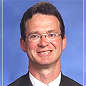 Dr. Eugene Coman, MD